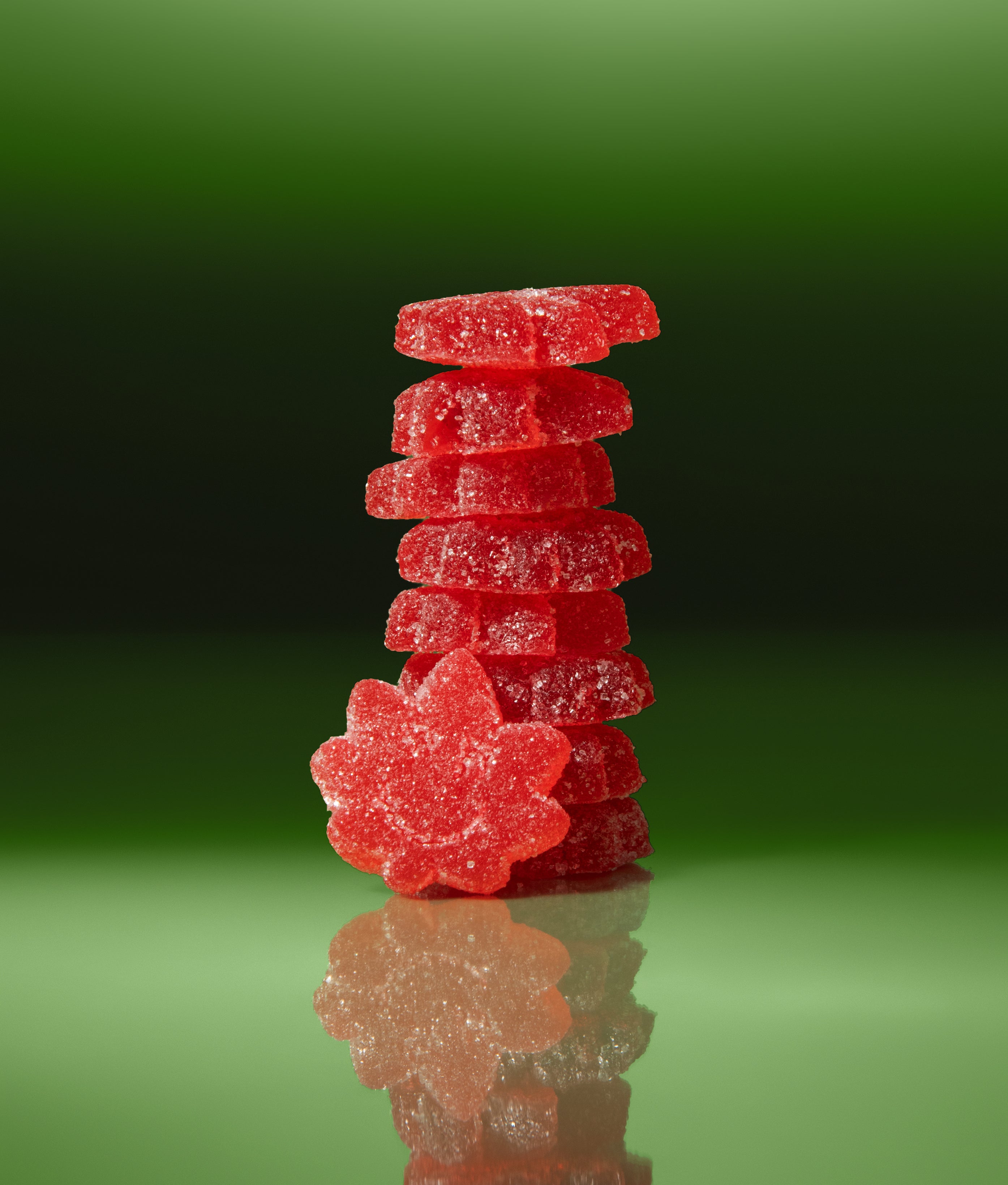 Vegan, all natural, sour watermelon gummies. Deliciously stacked in a pile, ready to be eaten!